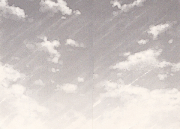 A two-page spread of a (grayscale) blue sky.